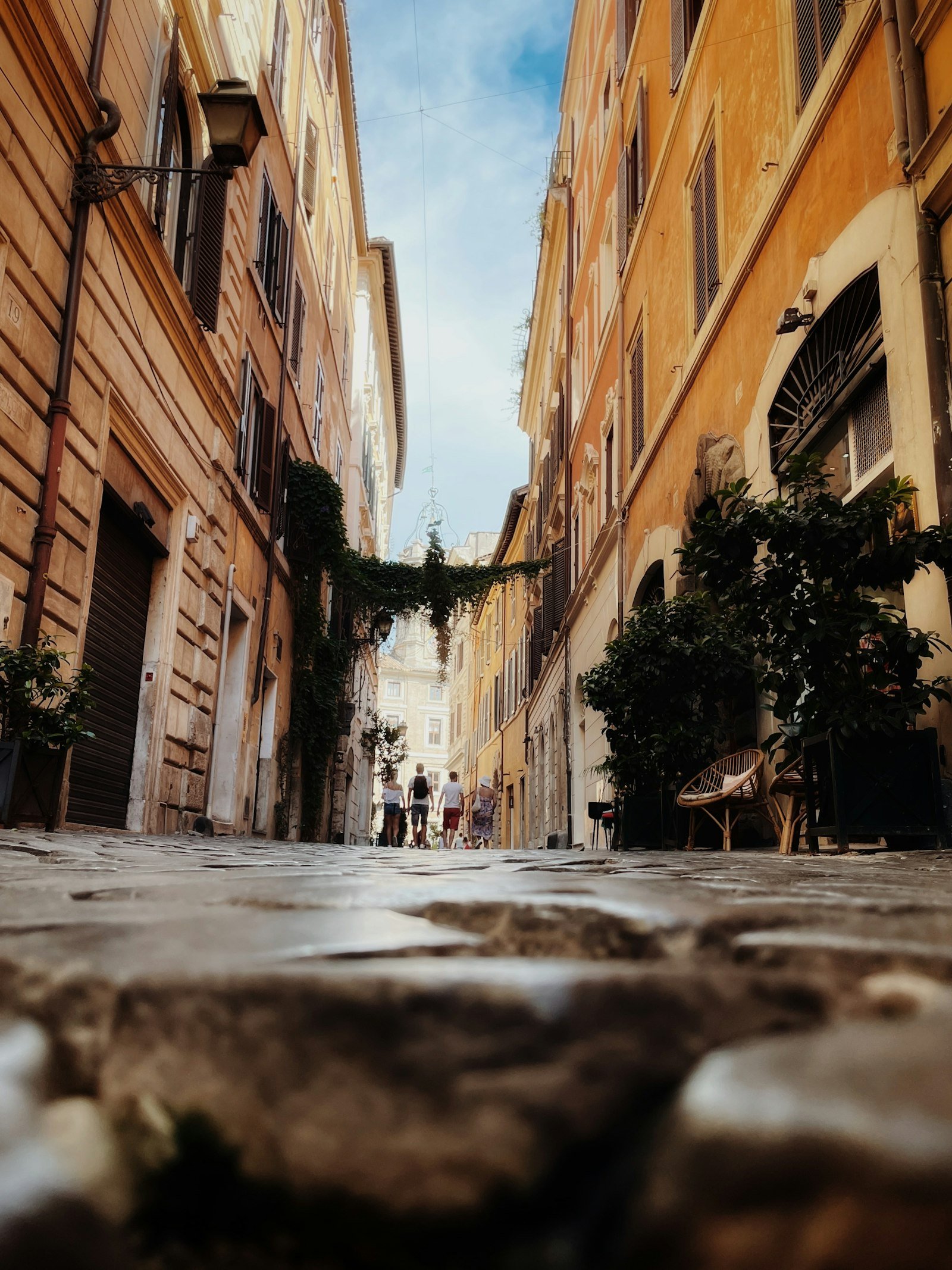 Narrow cobblestone street in Rome's Trastevere neighborhood