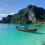 Traditional longtail boat on turquoise water in Thailand